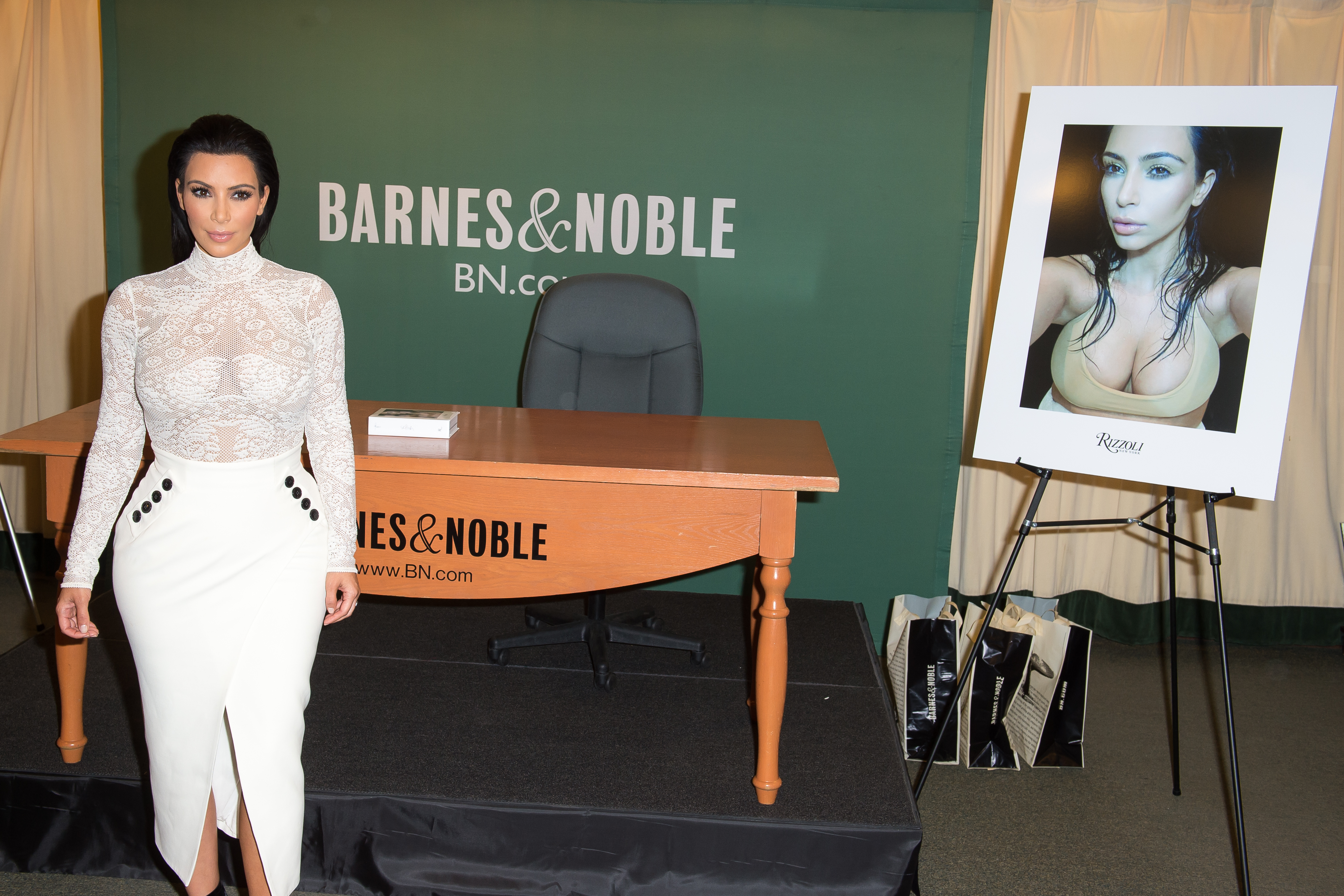 Kim Kardashian Signs Copies Of Selfish Empire Images Media